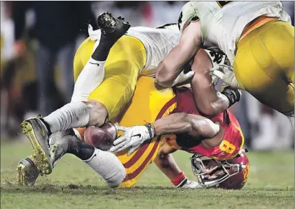  ?? Photograph­s by Wally Skalij Los Angeles Times ?? USC RECEIVER Amon-ra St. Brown can’t hold on to the football after making a catch in the fourth quarter at the Coliseum. The Trojans missed two opportunit­ies to put points on the board in the first half on fumbles after receptions.