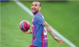  ?? Photograph: David Ramos/Getty Images ?? A delighted Dani Alves during his unveiling at Camp Nou. ‘It’s time to change and you need to be positive. That’s my mission here,’ he said.