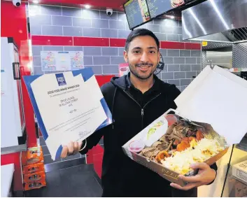  ??  ?? Prize guy
Sukhi serves up a munchy box