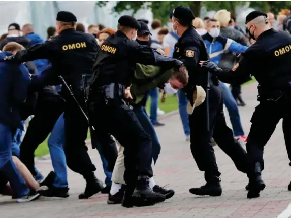  ?? (AP) ?? Officers detain activists at a protest in Minsk