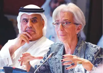  ?? Atiq Ur Rehman /Gulf News ?? IMF chief Christine Lagarde speaks at the Arab Fiscal Forum in Dubai yesterday, as Obaid Humaid Al Tayer, Minister of State for Financial Affairs, listens.