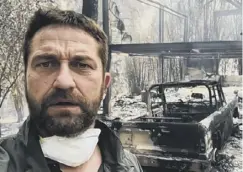  ??  ?? 0 Gerard Butler in the burned-out shell of his Malibu home