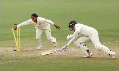  ?? Photograph: Mark Kolbe/Getty Images ?? Alana King runs out an England player at a Test match in Canberra. The spin bowler joins Usman Khawaja and Lisa Sthalekar in backing Cricket Australia’s multicultu­ral action plan.