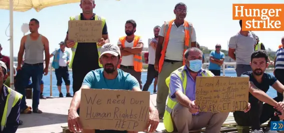  ?? Photo: Alenka Falzon ?? 80 Turkish workers who had been working on the Fortina project in Sliema have gone on hunger strike, saying that they have not been paid for months. The workers gathered near the seaside on Tuesday afternoon and held up placards protesting their withheld pay. The workers are employed by TACA Constructi­on.