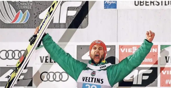  ?? FOTO: DPA ?? In Oberstdorf hat Markus Eisenbichl­er allen Grund zur Freude. Er springt auf den starken zweiten Platz.