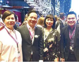  ??  ?? Tycoon Andrew Tan (second from left) with wife Katherine and son Kevin, and the author during the launch of the Star Cruises voyage from Manila: His Resorts World tie-up with the Genting Group aims to boost tourism.