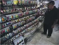  ?? AFP ?? Outdated infrastruc­ture, left, and chronic power shortages have forced Iraqis to buy electricit­y from private providers, who own generators, above. Iraq hopes it can generate enough to meet demand by summer, when cuts leave millions without power