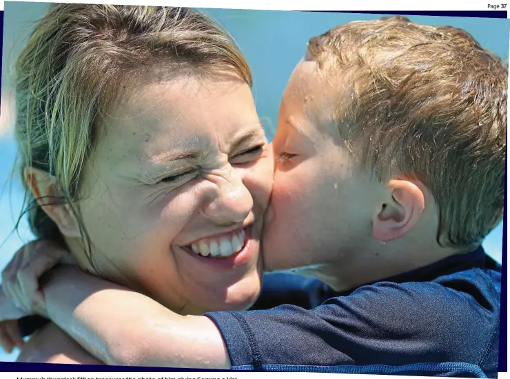  ??  ?? Mummy’s ‘huggles’: Ethan treasures the photo of him giving Gemma a kiss