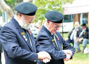  ??  ?? Host Shellhole Uqobolwayo Old Bill Theuns Stroebel and Zululand Dugout Old Bill Rob Wilson pay their respects after laying wreathes at the cenotaph