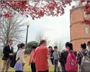  ??  ?? LEFT: Nic Diaz (left) of the Greater Rome Convention & Visitors Bureau relates the history of the Clock Tower.