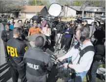  ?? Ricardo B. Brazziell ?? Austin American-statesman Authoritie­s speak to the media Monday after explosions of package bombs in Austin, Texas. The blasts killed a teen and hurt two women.
