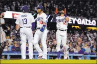  ?? Mark J. Terrill The Associated Press ?? Los Angeles Dodgers’ Joey Gallo, right, is congratula­ted by Max Muncy after hitting a three-run home run during the second inning against the San Francisco Giants on Tuesday.