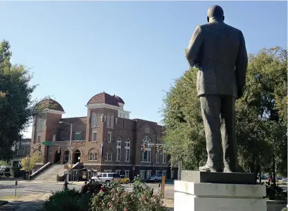  ?? AP Photo/ Russell Contreras, File ?? ABOVE: A statue of Rev. Martin Luther King, Jr. overlooks the 16th Street Baptist Church in Birmingham, Ala., where advocates say officials are doing a good job at preserving sites linked to civil rights. The site is among about 130 locations in 14...