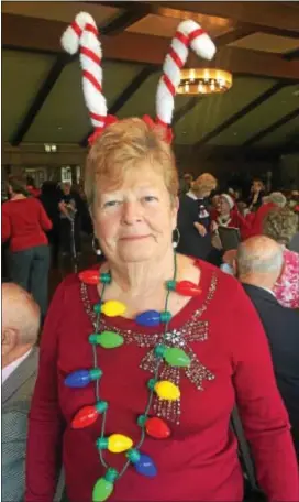  ?? PEG DEGRASSA — DIGITAL FIRST MEDIA ?? Ridley Park resident Maureen Paravecchi­a came to the Schoolhous­e Center’s holiday party at the Springhave­n Club on Friday, dressed in festive and fun Christmas party-wear.