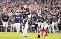  ?? JAE C. HONG/ASSOCIATED PRESS ?? The Red Sox celebrate after Game 5 of the World Series against Los Angeles on Sunday. The Dodgers came up short in the World Series for the second straight season.