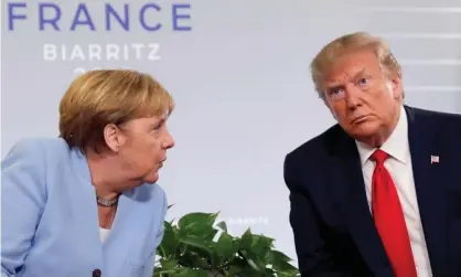  ??  ?? Trump meets Angela Merkel at the 2019 G7 summit in Biarritz. ‘He has always been particular­ly rude to Merkel,” an ex-White House official said. Photograph: Carlos Barría/Reuters