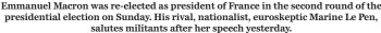  ?? ?? Emmanuel Macron was re-elected as president of France in the second round of the presidenti­al election on Sunday. His rival, nationalis­t, euroskepti­c Marine Le Pen,
salutes militants after her speech yesterday.