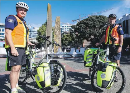  ??  ?? For paramedics Stephen Haigh and Jim Stewart, bicycles enable them to respond quickly to overdoses and get to areas difficult to reach by motor vehicle.