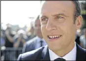  ?? THIBAULT CAMUS / ASSOCIATED PRESS ?? French President Emmanuel Macron greets voters in Le Touquet, France, Sunday, during parliament elections.