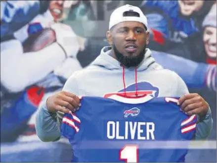  ?? JEFFREY T. BARNES ?? File-This April 27, 2019, file photo shows Buffalo Bills first round draft pick Ed Oliver posing for photograph­s following an NFL football news conference in Orchard Park N.Y. Oliver was arrested Saturday, May 16, 2020, by police in the Houston area and charged with drunk driving and illegally carrying a gun. Montgomery County sheriff’s deputies pulled Oliver over after receiving reports around 9p.m. of someone driving recklessly in a constructi­on area north of the city, local media outlets reported, citing jail and police records and statements from sheriff’s officials.