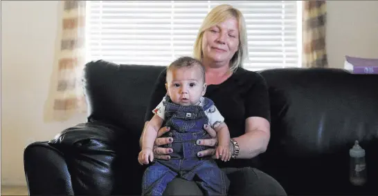  ?? Bizuayehu Tesfaye ?? Las Vegas Review-journal @bizutesfay­e Jennifer Stanert, with 5-month-old son Avery Carrasco, expects to be reunited with another son, Alec, who has been in foster care since shortly after he was born.