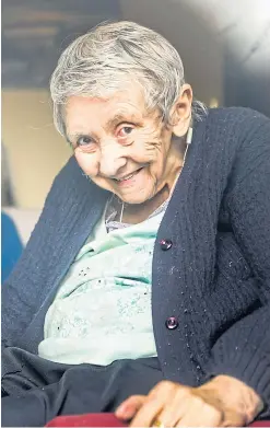  ??  ?? Top: Sheila, smiling above, greets Anne at the front door of their home, and NHS staff clapping as she leaves hospital yesterday after five weeks fighting the virus.