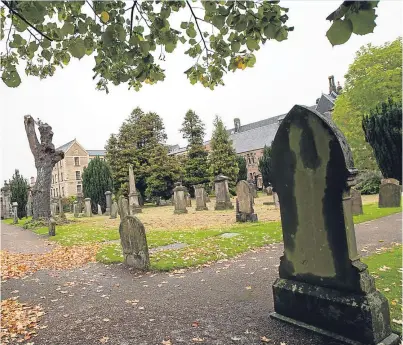  ?? Picture: Steve MacDougall. ?? Headstones at Greyfriars Cemetery were spray-painted by the vandals.