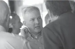  ?? Staff photo by Jim Williamson ?? Arkansas Lt. Gov. Tim Griffin chats with attendees Thursday during a meeting of the Greater Texarkana Young Profession­ala at Hopkins Icehouse in downtown Texarkana.