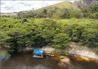  ?? (File Photo/AP/Andre Penner) ?? Wildcat miners mine illegally for gold Nov. 7 in the Ireng River on the Raposa Serra do Sol Indigenous reserve in Roraima state, Brazil, near the border with Guyana.