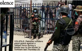  ??  ?? VOLATILE: Pakistani soldiers stand guard against a Taliban force during a media tour to the border in Torkham last Thursday (2)