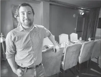  ?? CP PHOTO ?? Sam Murphy, general manager of the Barrington Steakhouse and Oyster Bar, stands in their Legacy Room in Halifax. The dining room, one of five Legacy Rooms in the city, offers a private, safe-space environmen­t intended to promote reconcilia­tion between...