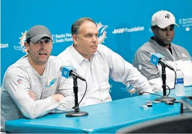  ?? WILFREDO LEE/AP ?? Miami Dolphins head coach Adam Gase, left, is loud in his backing of Mike Tannenbaum, center, the team’s executive vice president of football operations. General Manager Chris Grier is at right.