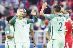  ?? - AFP photo ?? Portugal’s forward Cristiano Ronaldo (L) celebrates with Portugal’s defender Bruno Alves after winning their 2017 Confederat­ions Cup group A football match against Russia at the Spartak Stadium in Moscow on June 21, 2017.