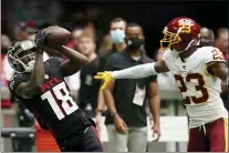  ?? BRYNN ANDERSON — THE ASSOCIATED PRESS ?? Atlanta Falcons wide receiver Calvin Ridley, left, misses the catch against Washington Football Team cornerback William Jackson during the first half of a game last month in Atlanta.