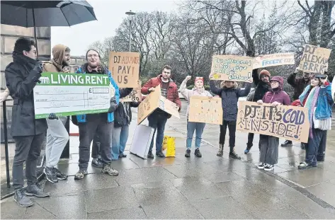  ?? ?? Edinburgh flatmates Stuart and Rory joined Living Rent to protest outside DJ Alexander