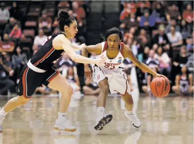  ?? Jim Gensheimer / Special to The Chronicle ?? Stanford freshman Kiana Williams, shown being guarded by Gonzaga’s Jessie Loera, has made 27 of her past 44 attempts from three-point range. She led Stanford with 21 points in Saturday’s NCAA Tournament first-round win over visiting Gonzaga.