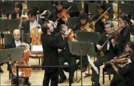  ?? KOJI SASAHARA — THE ASSOCIATED PRESS ?? Finland’s Pietari Inkinen conducts the Japan Philharmon­ic Orchestra during their concert at Suntory Hall in Tokyo.