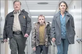  ?? SEARCHLIGH­T PICTURES ?? From left, Jesse Plemons, Jeremy T. Thomas and Keri Russell star in the thoughtpro­voking supernatur­al thriller “Antlers.”