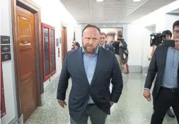  ?? TOM BRENNER THE NEW YORK TIMES ?? Alex Jones, the right-wing conspiracy theorist and talk show host, has infuriated Sandy Hook families by questionin­g the reality of that tragedy.