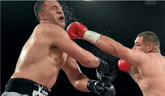  ?? PHOTO: PHOTOSPORT ?? Andy Ruiz lands a left to the face of Joseph Parker during their WBO world heavyweigh­t title fight in Auckland.