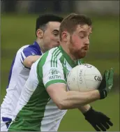  ??  ?? St Pat’s Ciaran Doyle challenges Kevin Murphy.