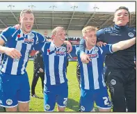  ??  ?? JUST CHAMPION: Wigan players celebrate their title