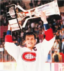  ?? DENIS BRODEUR/NHLI VIA GETTY IMAGES FILES ?? Canadiens captain Guy Carbonneau hoists the Prince of Wales Trophy after defeating the New York Islanders in May 1993, en route to the Stanley Cup Finals.