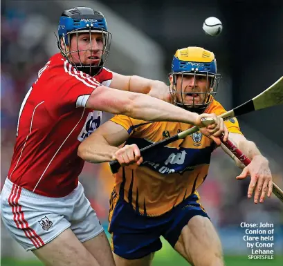  ?? SPORTSFILE ?? Close: John Conlon of Clare held by Conor Lehane