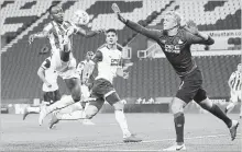  ?? MARTIN RICKETT THE ASSOCIATED PRESS ?? Former England striker Saido Berahino, left, scored his first goal in more than two years to help Stoke advance in the Carabao Cup.