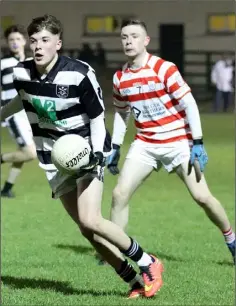  ??  ?? Tomás Sheridan of St. Joseph’s is tracked by Adrian Breen.