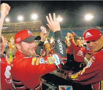  ?? JONATHAN FERREY/GETTY ?? Dale Earnhardt Jr. bid a fond farewell to his Cup Series career Sunday in the finale at Homestead-Miami Speedway.