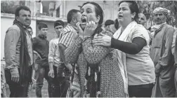  ?? DELIL SOULEIMAN/AFP VIA GETTY IMAGES ?? A woman reacts as the body of a man killed during Turkish shelling arrives at a hospital in the Syrian town of Tal Tamr Friday.