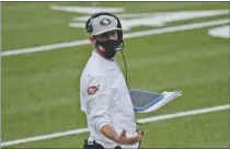  ?? BILL KOSTROUN — THE ASSOCIATED PRESS ?? San Francisco head coach Kyle Shanahan works on the sidelines during the second half against the Giants on Sunday in East Rutherford, N.J.