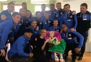  ??  ?? ●●Rochdale AFC players visit Josh McCormack at Derian House Children’s Hospice